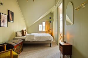 a bedroom with a bed in a attic at VILLA BRATTHOLMEN in Brattholmen