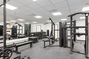 a gym with several treadmills and machines at Slopeside Bliss C21 Levi Center by Aavalevi in Levi
