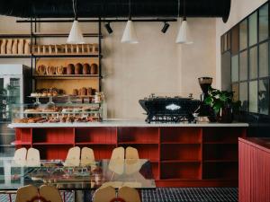 a bakery with a counter with shoes in a window at The Dean Berlin in Berlin