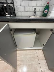 a kitchen counter with a sink and a drawer at Private Studio by Wembley in Preston
