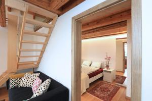 a bedroom with a bunk bed and a ladder at Kellerstöckl Pachler in Bad Gleichenberg