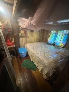 an overhead view of a bedroom with a bed at Tan Homestay in Ko Lanta +21 photos