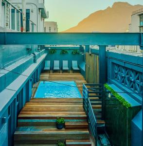 a swimming pool on the balcony of a building at Old Bank Hotel - Lion Roars Hotels & Lodges in Cape Town