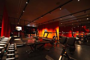 a gym with chairs and equipment in a room at IBIS STYLES KINSHASA in Kinshasa