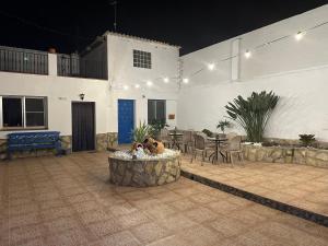 a courtyard with a table and chairs in a building at La Marquesa - CA L'ONA in Poblenou del Delta