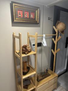 a shelf in a room with a picture on the wall at Luxury Capsule Haus Phuket in Panwa Beach +39 photos