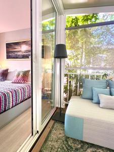 a bedroom with a balcony with a bed and a window at Luxury Camp at Union Lido in Cavallino-Treporti