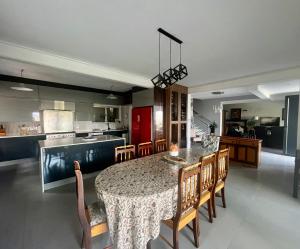 a kitchen and dining room with a table and chairs at Paarl View House in Paarl
