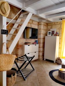 a kitchen with a staircase and a refrigerator in a room at Nanà Maison in Nardò +34 photos