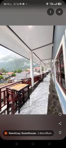 a view of a building with tables and benches at Keomisay in Nongkhiaw