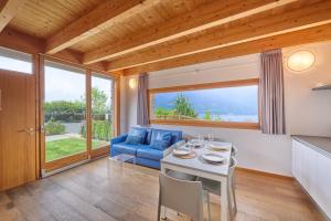 a kitchen and living room with a table and chairs at house with 3 bedrooms T5 in Bellano +45 photos