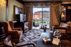 a living room with a view of a building at Grand Hotel Dino in Baveno