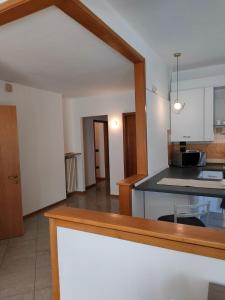 a kitchen with a counter top in a room at Marconi 33A in Pergine Valsugana +12 photos