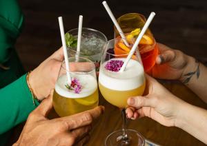 a group of people holding up glasses of drinks at Campanile PRIME - Troyes Nord Barberey in Troyes