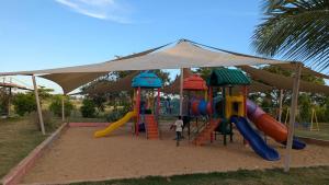 a child playing on a playground with a slide at 1brm,2bdrm,3bdrm Palm Ridge Heavens Vipingo in Kilifi