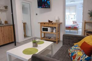 a living room with a couch and a table at Wendy House - Central Sofia - 3BRDR - Private Courtyard - 5 min to Vitosha blvd in Sofia