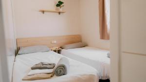 two beds sitting next to each other in a room at Nice Camps - L Estartit in L'Estartit +74 photos