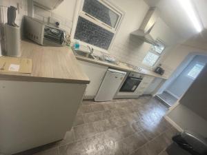 a kitchen with a sink and a counter top at Modern 3-Bed House in Ramsgate Close to Seafront in Ramsgate