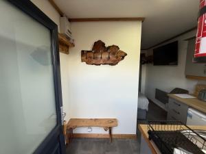 a room with a wall with a piece of wood on the wall at Thurso Accommodation in Castletown