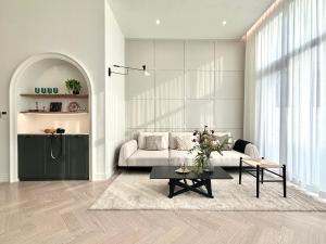 a living room with a couch and a table at FORESTE Haus 포레스테하우스 in Seoul