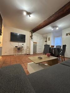 a living room with a flat screen tv on the wall at Chez Luna in Sisteron