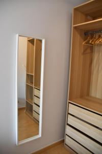 a mirror in a walk in closet with a dresser at Rincón Costero in Rincón de la Victoria