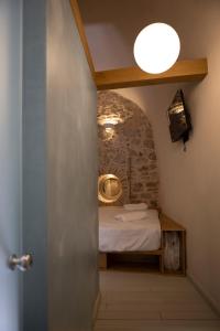 a bedroom with a bed in a room at Yermata Kalamoti in Kalamoti