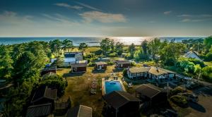an aerial view of a resort with a swimming pool at Strandbacka Stugor in Gnisvärd