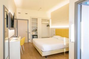 Postel nebo postele na pokoji v ubytování Hotel Bareta + 50 fotografií