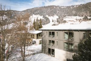 an aerial view of a building in the snow at Kersh Dolomites Lodge in San Candido