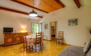 a dining room with a table and chairs in a room at Casa Lisandru in Croce