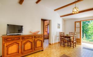 a living room with a television and a dining room at Casa Lisandru in Croce +37 photos