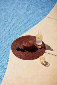 a pool with a drink and aasteryasteryasteryasteryasteryasteryasteryasteryastery at Hotel IPV Palace & Spa - Adults Recommended in Fuengirola +136 photos