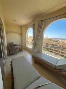 a bedroom with a bed and a large window at florenza Resort - Hurghada Egypt in Hurghada +238 photos