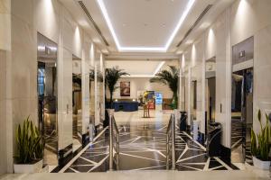a hallway with plants in a building at View Al Madinah Hotel in Medina