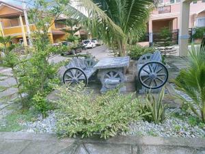 a park with a bench and a picnic table at AD3M Haven's Place in Bantug +13 photos