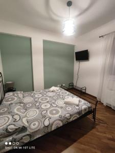 a bedroom with a bed and a television in it at amaRE in Reggio Emilia +8 photos