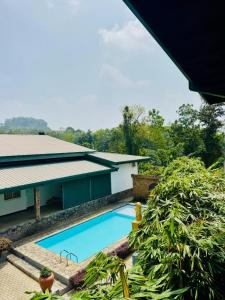 a view of a pool at the villa sigiriya at Resolve Garden Hotel in Dodangoda