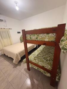a bedroom with a bunk bed in a room at Solares de Sabatini in Villa del Totoral