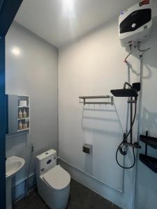 a bathroom with a toilet and a sink at Lunara Homestay in Phú Vang