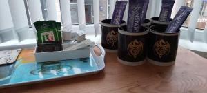 a group of three trash cans sitting on a table at The Celtic Pride Hotel in Blackpool +29 photos