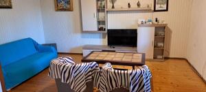 a living room with a couch and a table at Apartments Stanko in Sumartin