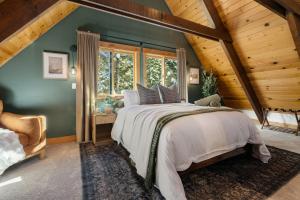 a bedroom with a large bed and a wooden ceiling at Starlight Chalet Lake Tahoe in Carnelian Bay