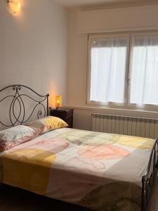 a bedroom with a large bed in a room at borgo nel vigneto 2 in Erbusco