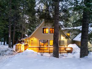 a house with a porch in the snow at Starlight Chalet Lake Tahoe in Carnelian Bay