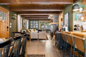 a restaurant with a bar and a living room at Starlight Chalet Lake Tahoe in Carnelian Bay