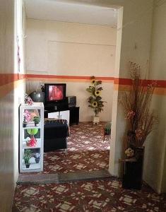 a hallway with a living room with a television and a room with at Hospedaria Praia e Sol in Fortaleza +16 photos