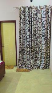 a room with a door and a curtain next to a door at Sahib ka Ghar in Kharar