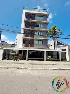 a tall building on the side of a street at Vista Mare 402 in Ilha da Restinga