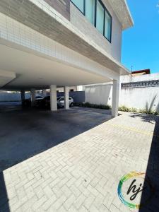 an empty parking lot in front of a building at Vista Mare 402 in Ilha da Restinga +25 photos